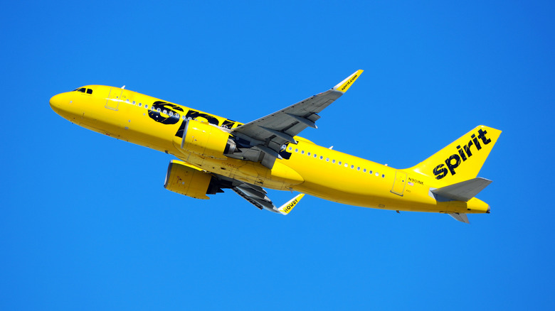 Yellow Spirit Airlines plane flying