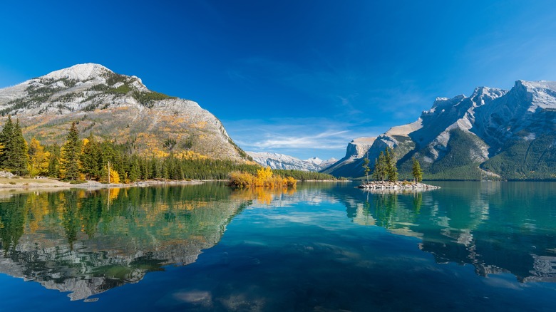 Lake Minnewanka landscape with mountains and blue skies