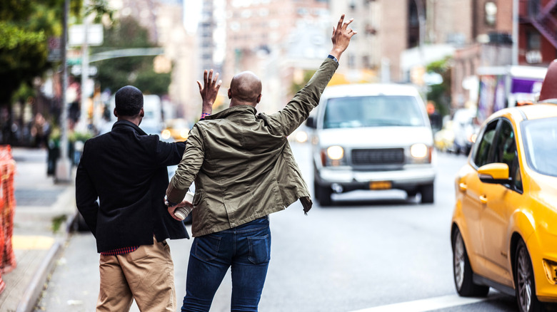 Travelers hailing a cab