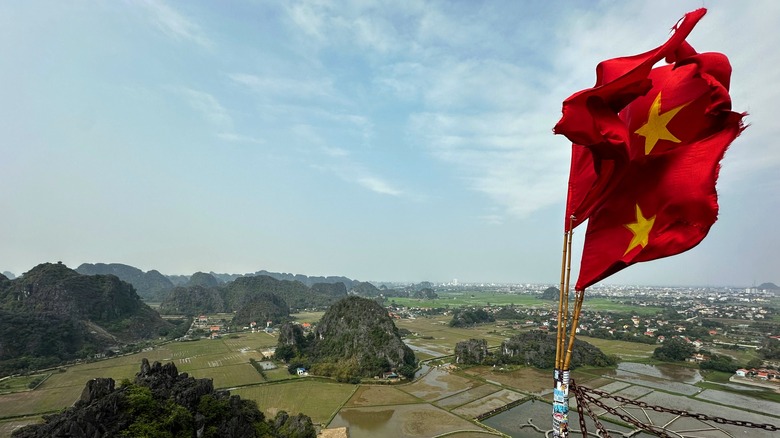 Vietnam flag and aerial view of countryside