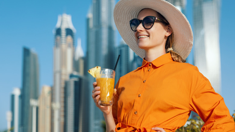 Tourist drinking cocktail in Dubai