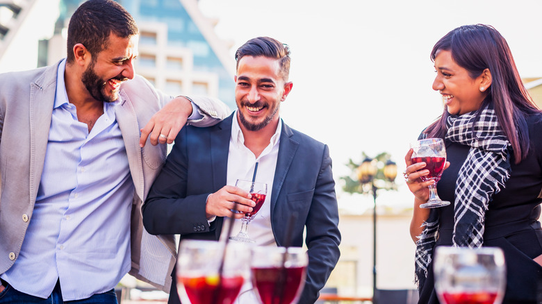 Friends enjoying drinks at bar