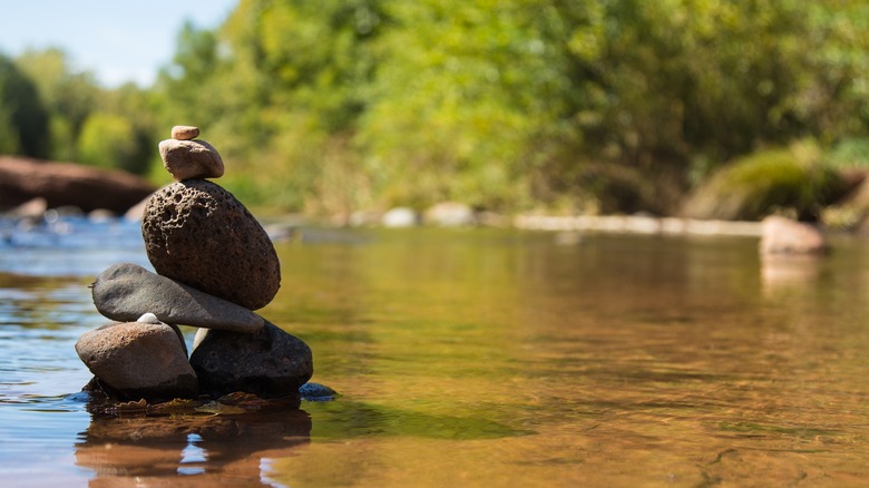 A rock tower in a river