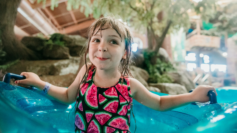 Child holding pool inflatable