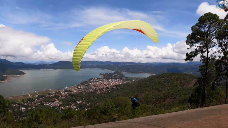 Paragliding over cliff