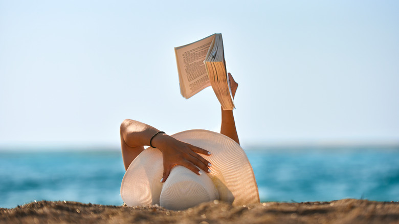 person reading at beach