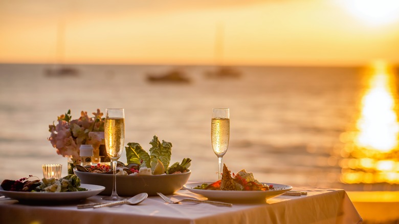 Dining at the beach at sunset