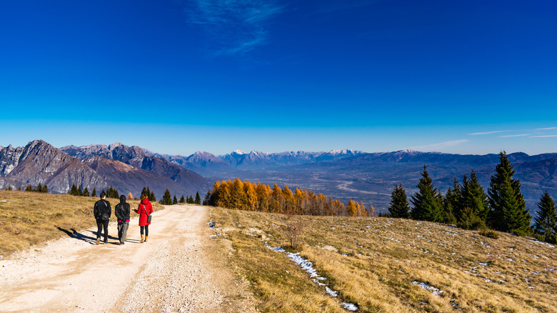 Hikers strolling through Dolomiti Bellunesi