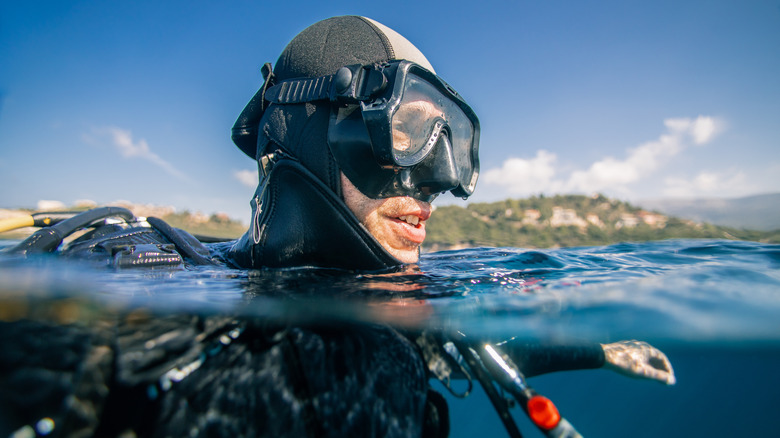 Scuba diver preparing to dive