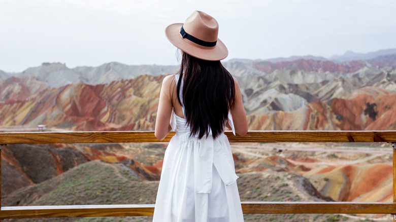 Woman looking out over mountains