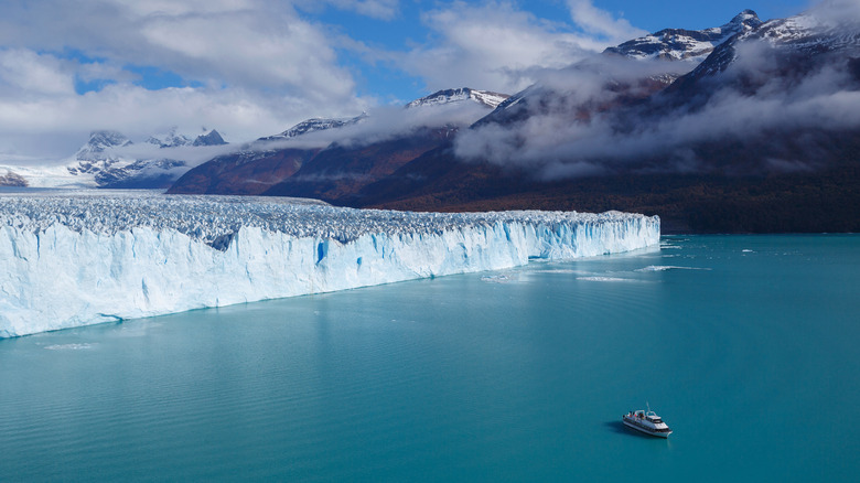 boat approaches a glacier