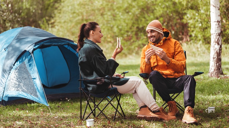 Couple eating outside of tent