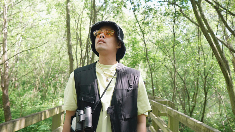 Man enjoying birdwatching in the woods