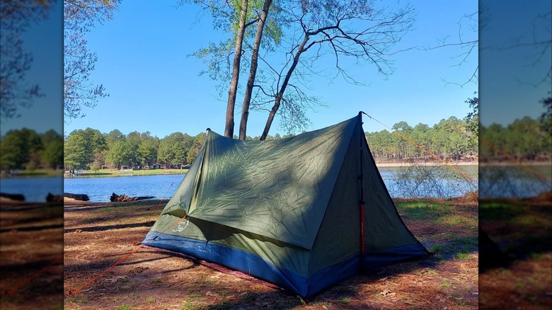 Rustic tent  by a lake