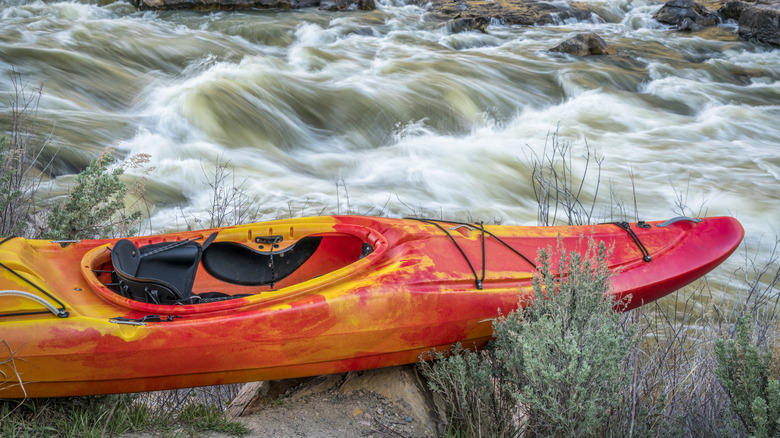 kayak by Colorado river rapids