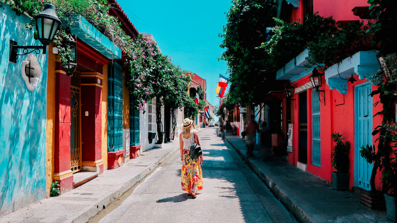 Woman on colorful street in Cartagena