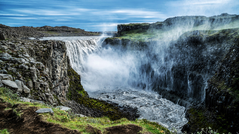 Dettifoss waterfall in green landscape