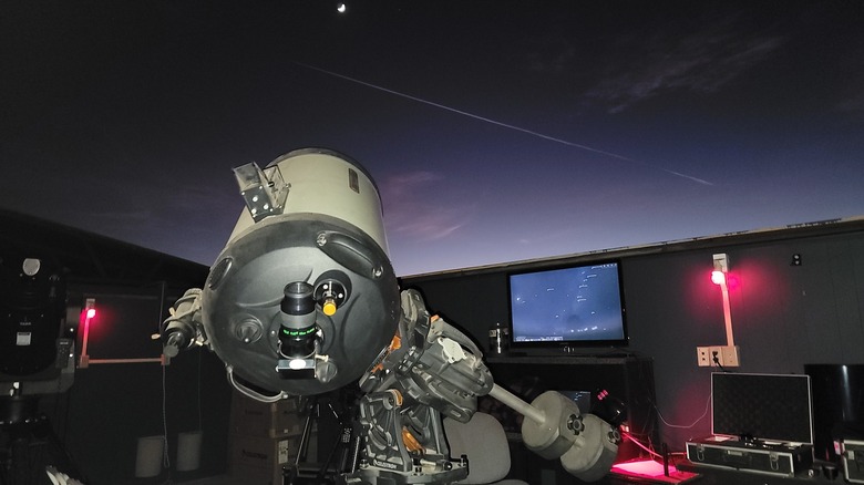 Telescope against night sky