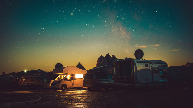 RV campers stargazing 