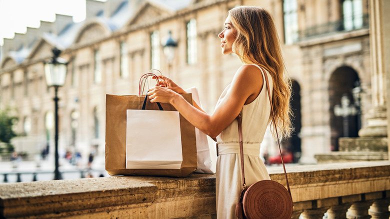 stylish woman shopping in Paris