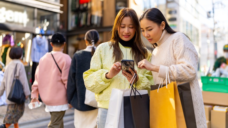 Two women holding shopping bags