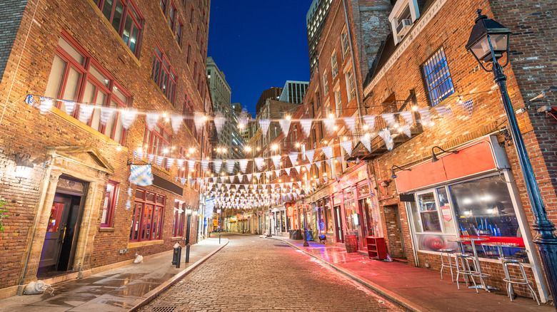 street with buildings and string lights