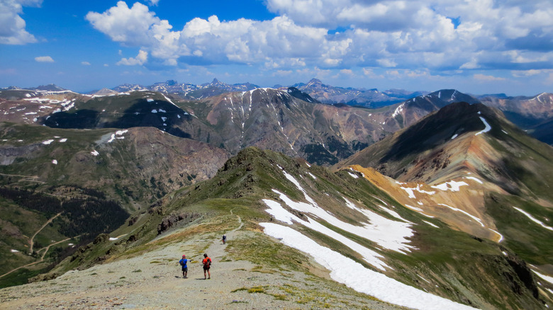 hikers nearing the summit of Handies Peak