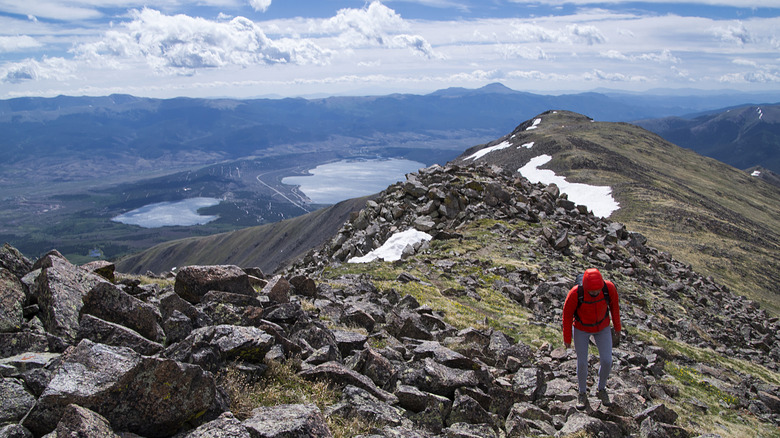 hiker summiting Mt. Elbert in Colorado