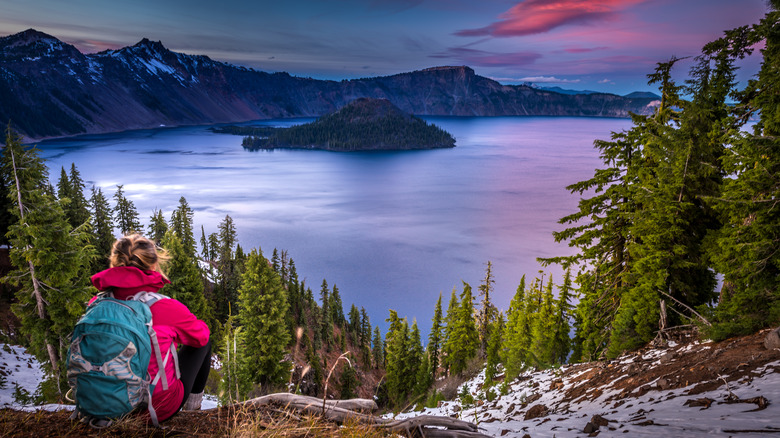 woman sitting look at lake in mountain