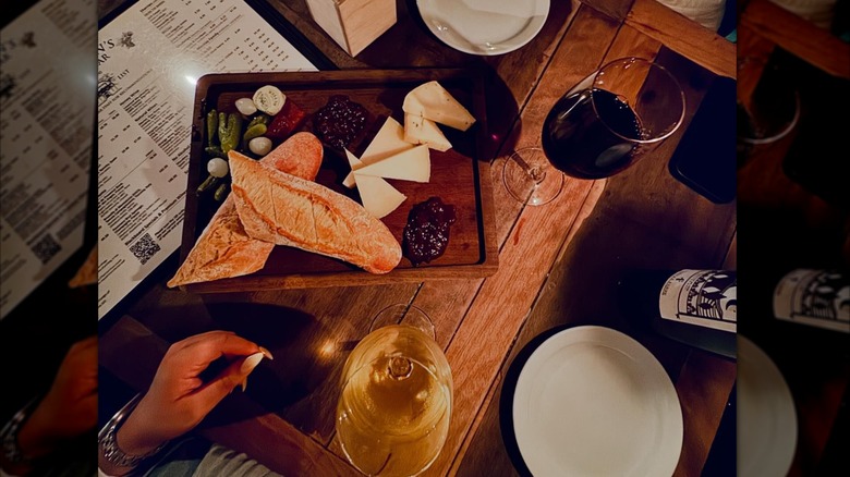 wine on table with chacuterie