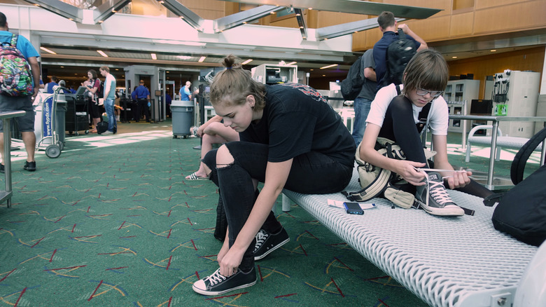 a woman going through airport TSA