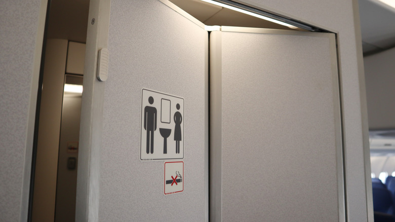 airplane toilet door open