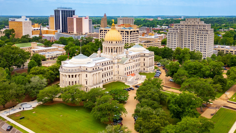 Aerial city view with large white building