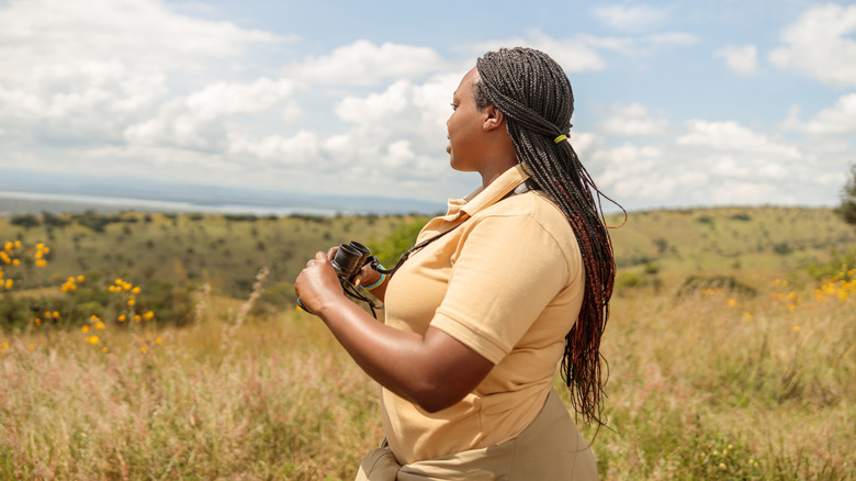 Black woman and man in safari vehicle