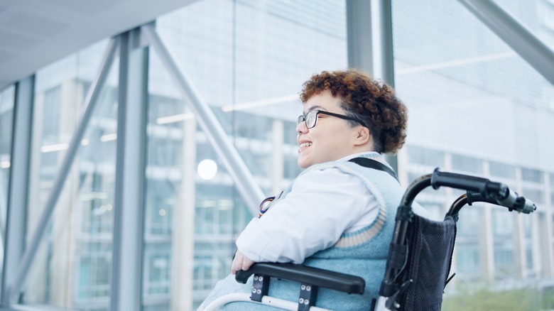 Traveler in wheelchair at boarding gate