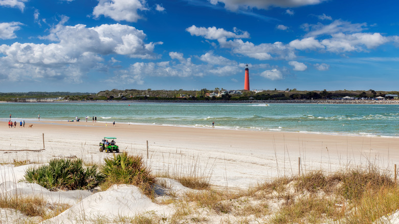 New Smyrna Beach with a lighthouse in the distance