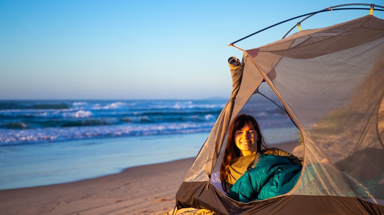 Woman beach camping