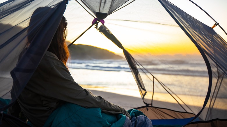 Girl camping at beach