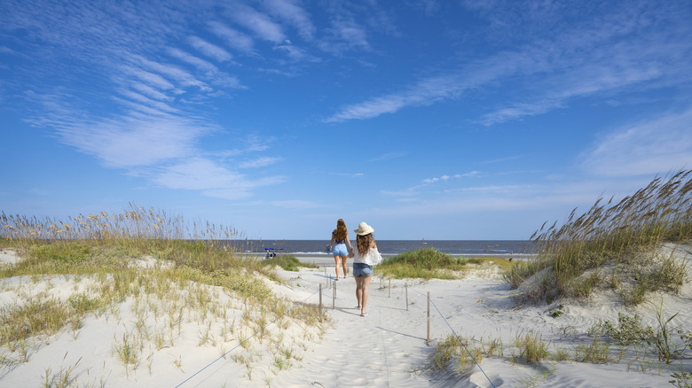 A woman walking on the beach at Jekyll Island