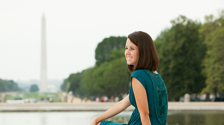 A woman by Reflecting Pool in DC