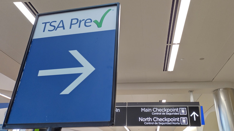 Sign pointing to TSA PreCheck at airport