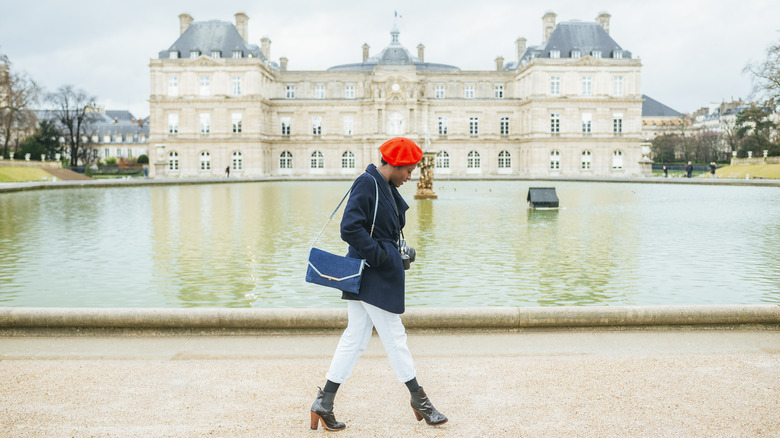 Stylish woman in front of castle