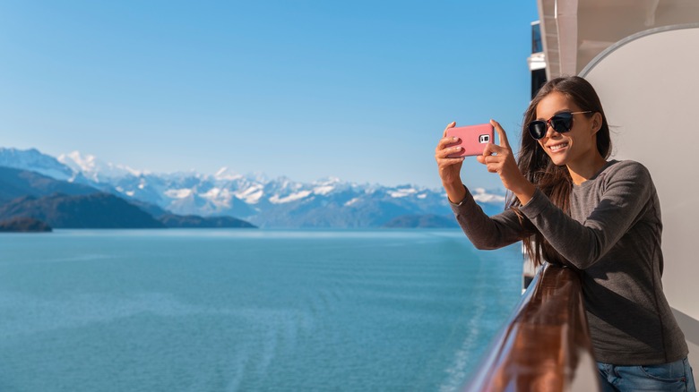 Passenger taking photo on cruise