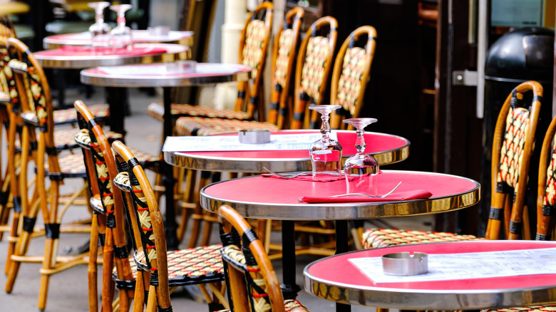 Tables and chairs outside Paris café