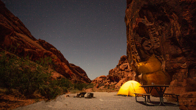 tent in red rocks at night