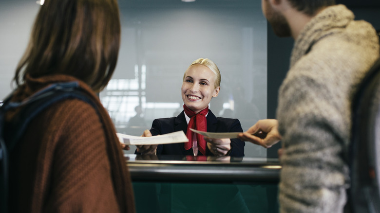 Travel couple at airline counter