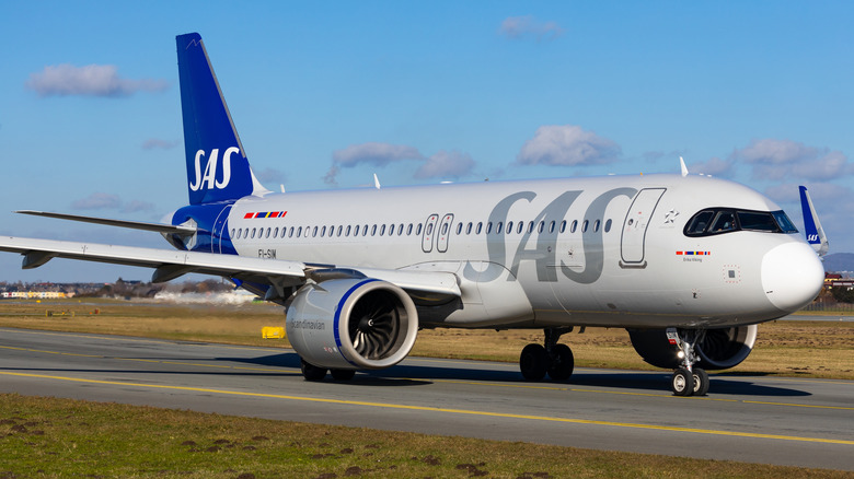 Scandinavian Airlines aircraft parked on runway