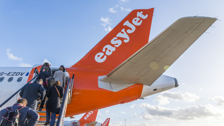 Travelers boarding easyJet airplane