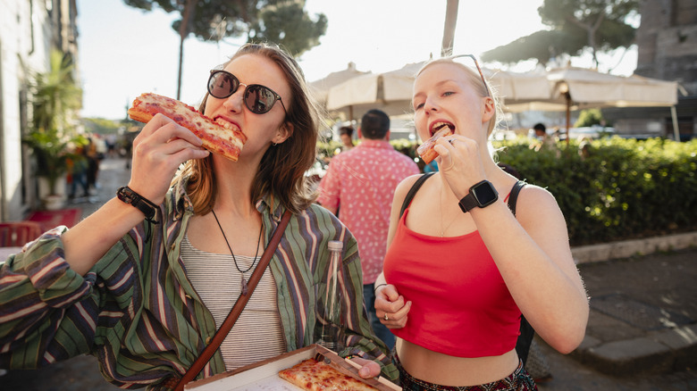 Women eating pizza