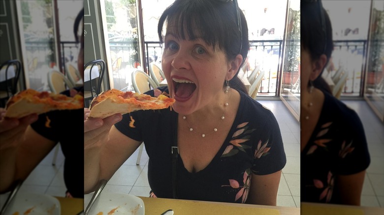 Woman eating pizza